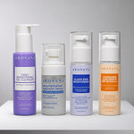 AROVANA Daily Brightening Gel Cleanser in purple, Deep Hydration Hyaluronic Serum in frosted gray, Glass Skin Moisturizer in white with blue label, and Hydrating Sun Shield SPF 50+ in white with orange label.
